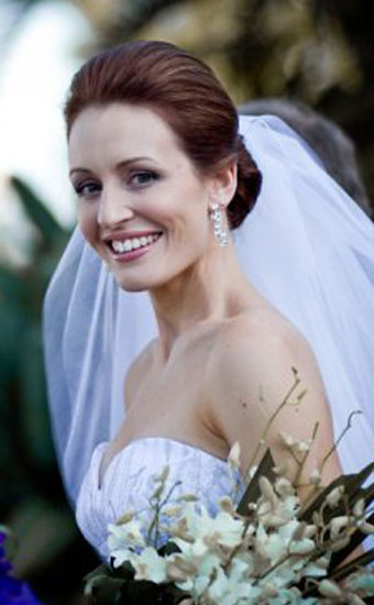 Smiling bride with a upstyle hairstyle